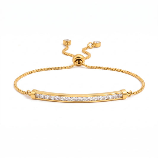 Meinara Amara gold-plated stainless steel bracelet with a crystal-set bar and adjustable sliding bolo closure.