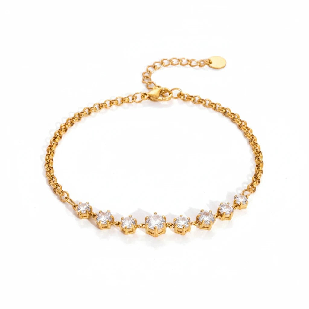 Meinara Aria bracelet featuring a gold chain with a row of sparkling round-cut clear crystals on a white background.