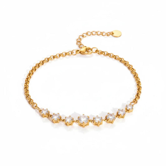 Meinara Aria bracelet featuring a gold chain with a row of sparkling round-cut clear crystals on a white background.