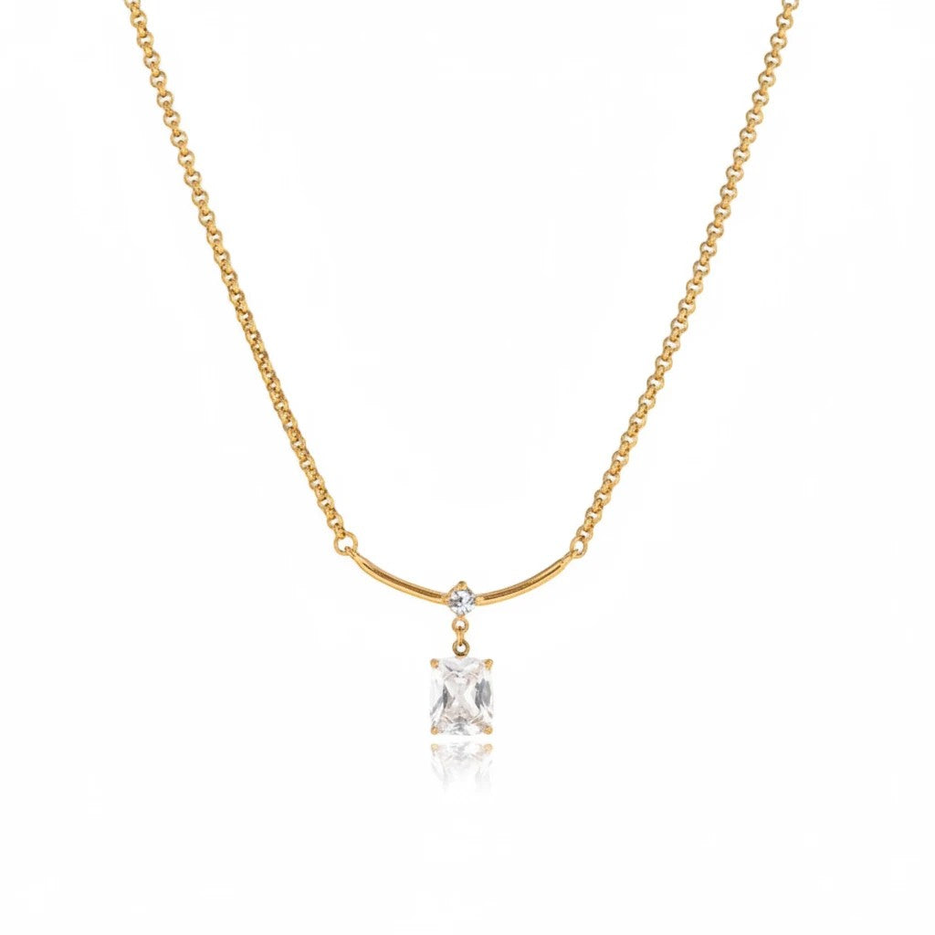 Meinara Aura gold necklace with a rectangular crystal drop pendant on a delicate stainless steel chain.