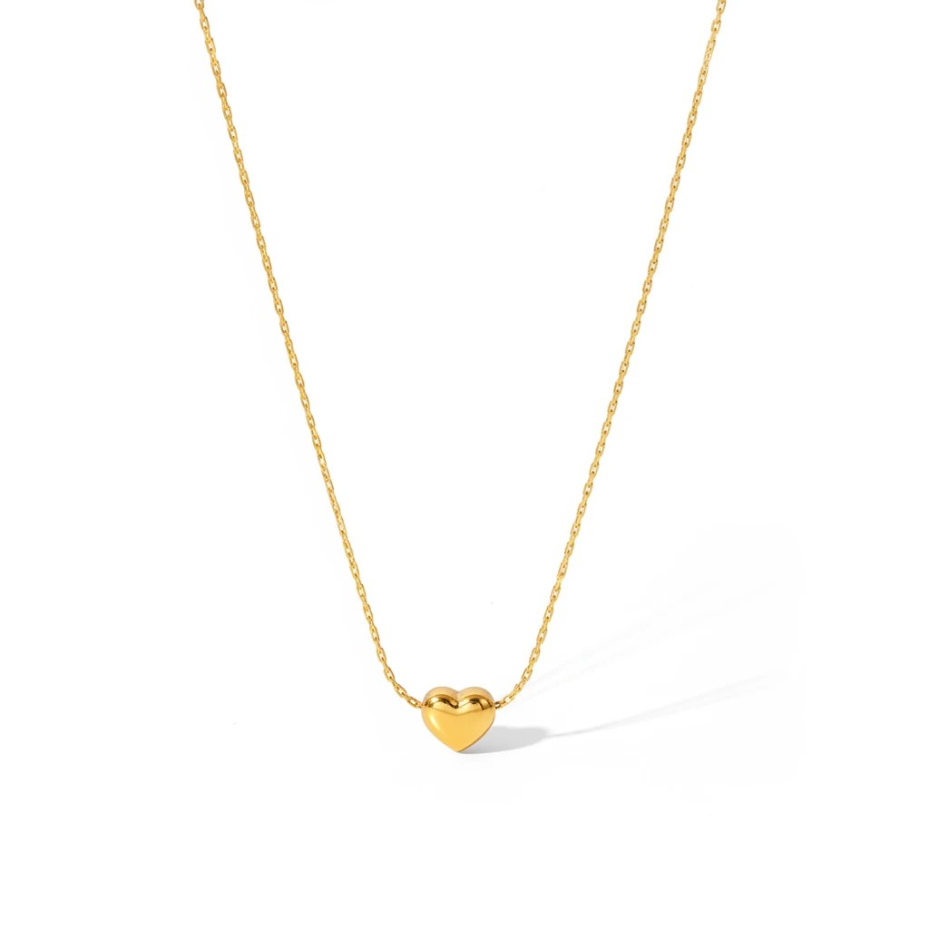 Meinara Cora necklace featuring a polished gold heart pendant on a delicate stainless steel chain