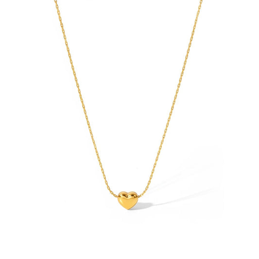 Meinara Cora necklace featuring a polished gold heart pendant on a delicate stainless steel chain