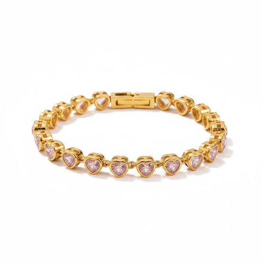 Meinara Eden bracelet featuring a gold chain with delicate pink heart-shaped crystals in a tennis style setting