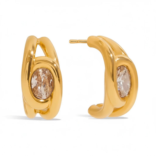 Meinara Elara gold hoop earrings featuring a central oval-cut champagne crystal in a polished metal setting