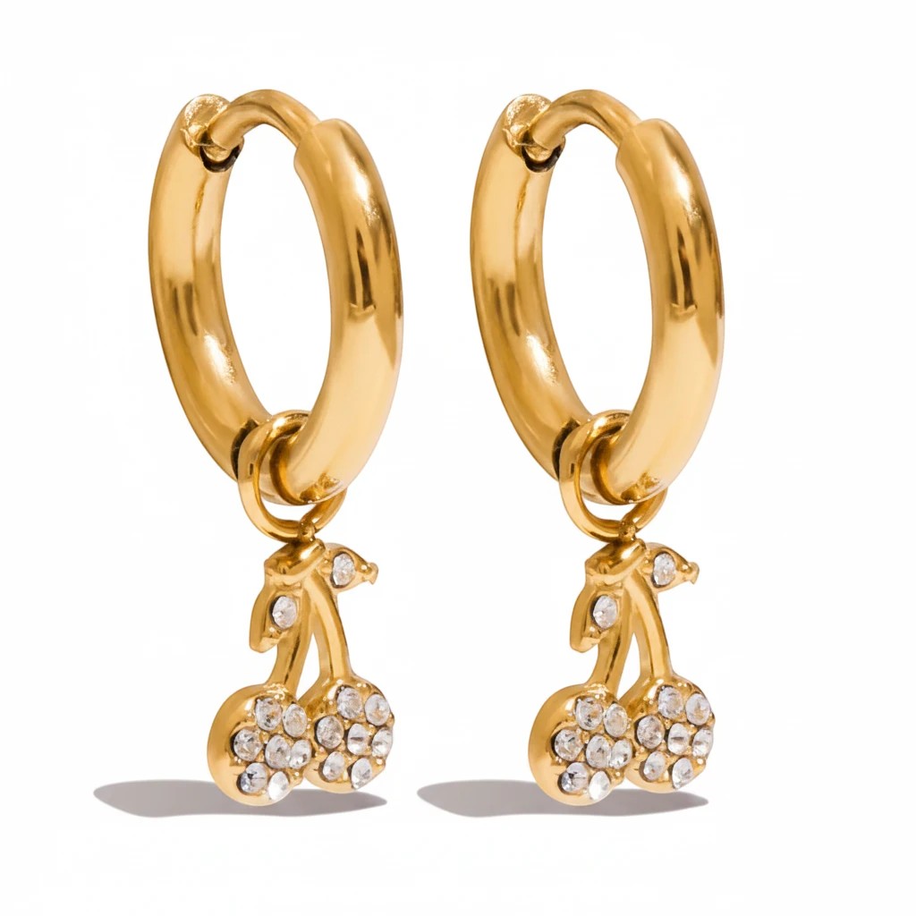 Meinara Elina gold hoop earrings featuring dangling cherry charms encrusted with sparkling white crystals