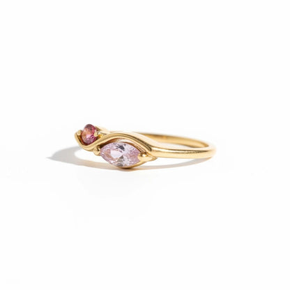Meinara Freya ring in 18k gold plated stainless steel with delicate pink marquise-cut stones on a sculptural band.