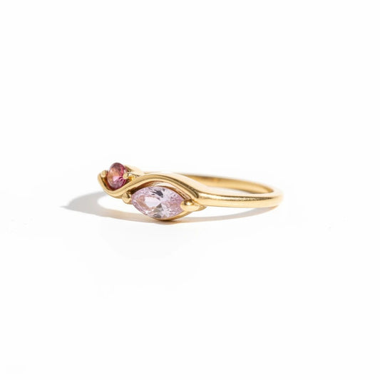 Meinara Freya ring in 18k gold plated stainless steel with delicate pink marquise-cut stones on a sculptural band.