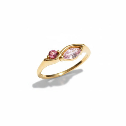 Meinara Freya ring in 18k gold plated stainless steel with a sculptural band and pink marquise-cut stone accents.