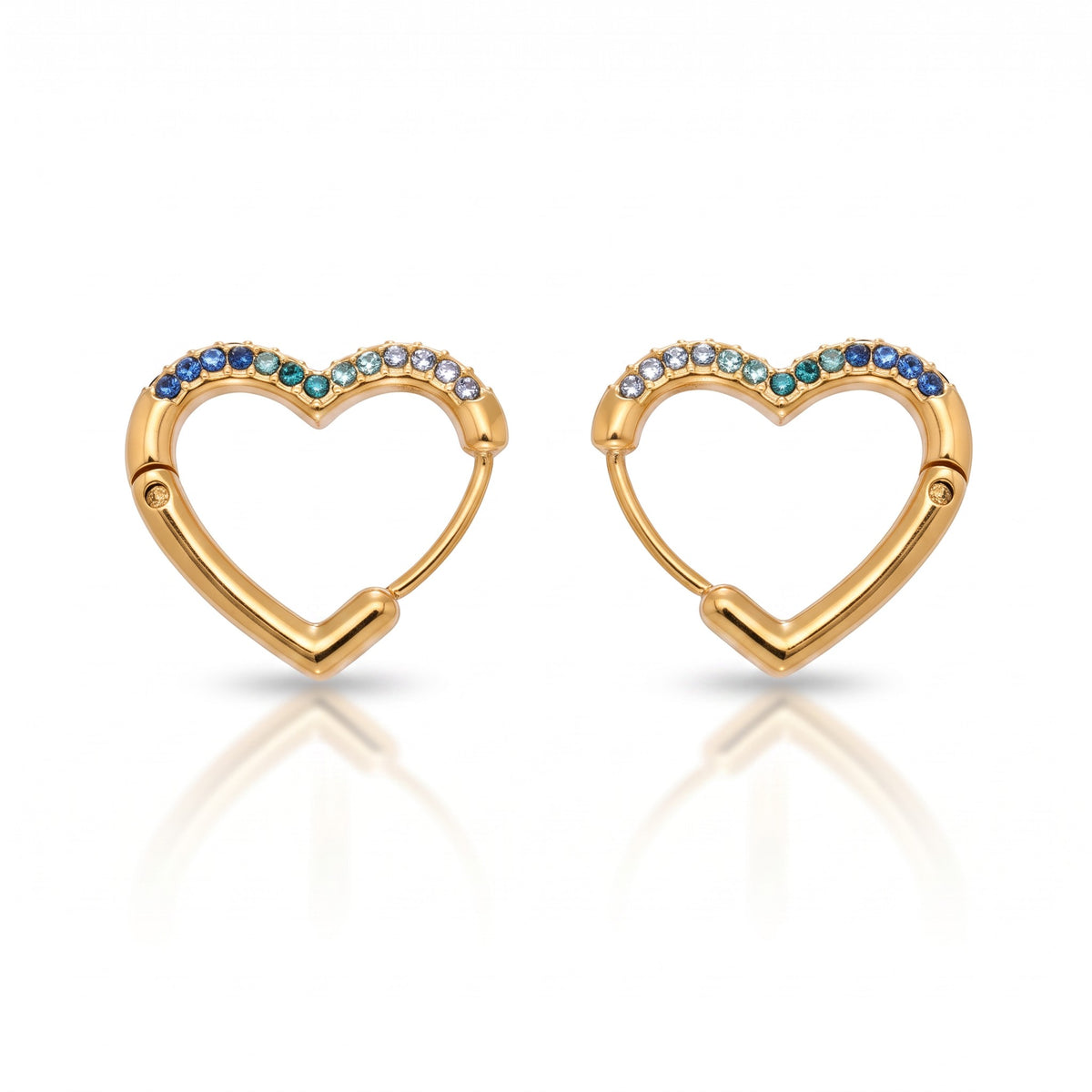 Meinara Lina heart-shaped gold hoop earrings featuring a gradient of blue and white crystals on a white background