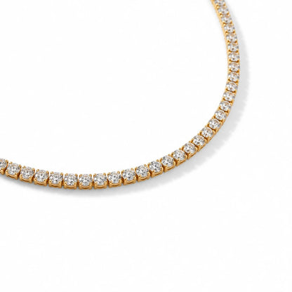 Meinara Lumi necklace featuring a classic gold tennis chain set with sparkling round-cut clear crystals