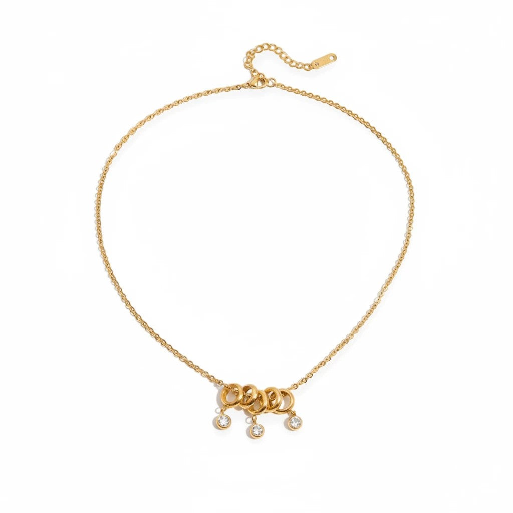 Meinara Lyra necklace in 18k gold plated stainless steel with interlocking rings and dangling crystal drops
