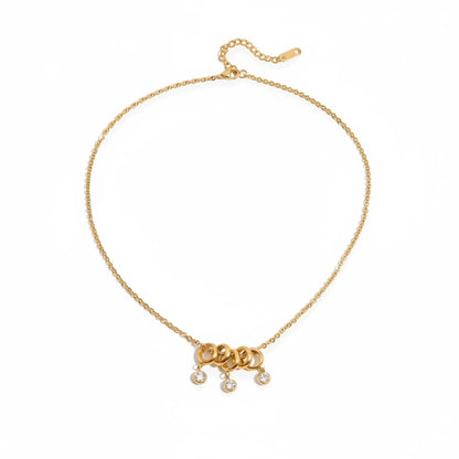 Meinara Lyra necklace in 18k gold plated stainless steel with interlocking rings and dangling crystal drops