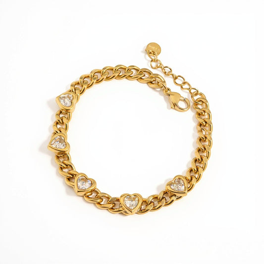 Meinara Vera bracelet featuring a gold-tone chain link design with five sparkling heart-shaped cubic zirconia stones.